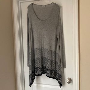 Grey with fading to black pattern toward hemline.